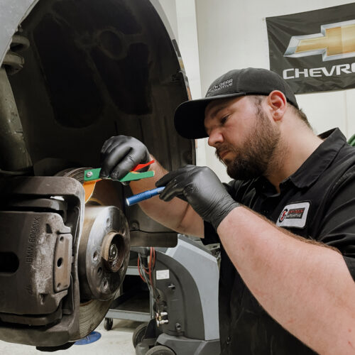 A Fifth Gear Auto Technician is providing brake service and maintenance to a customers vehicle.