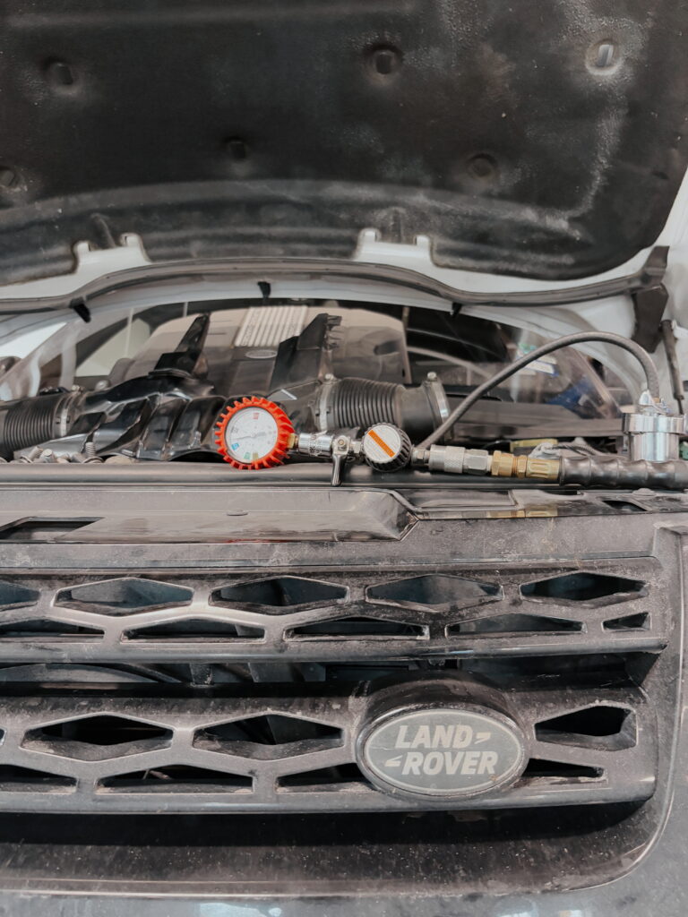 Fifth Gear Auto Tech Servicing a Vehicle's A/C