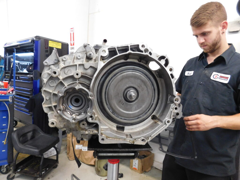 Auto Tech performing a transmission repair service