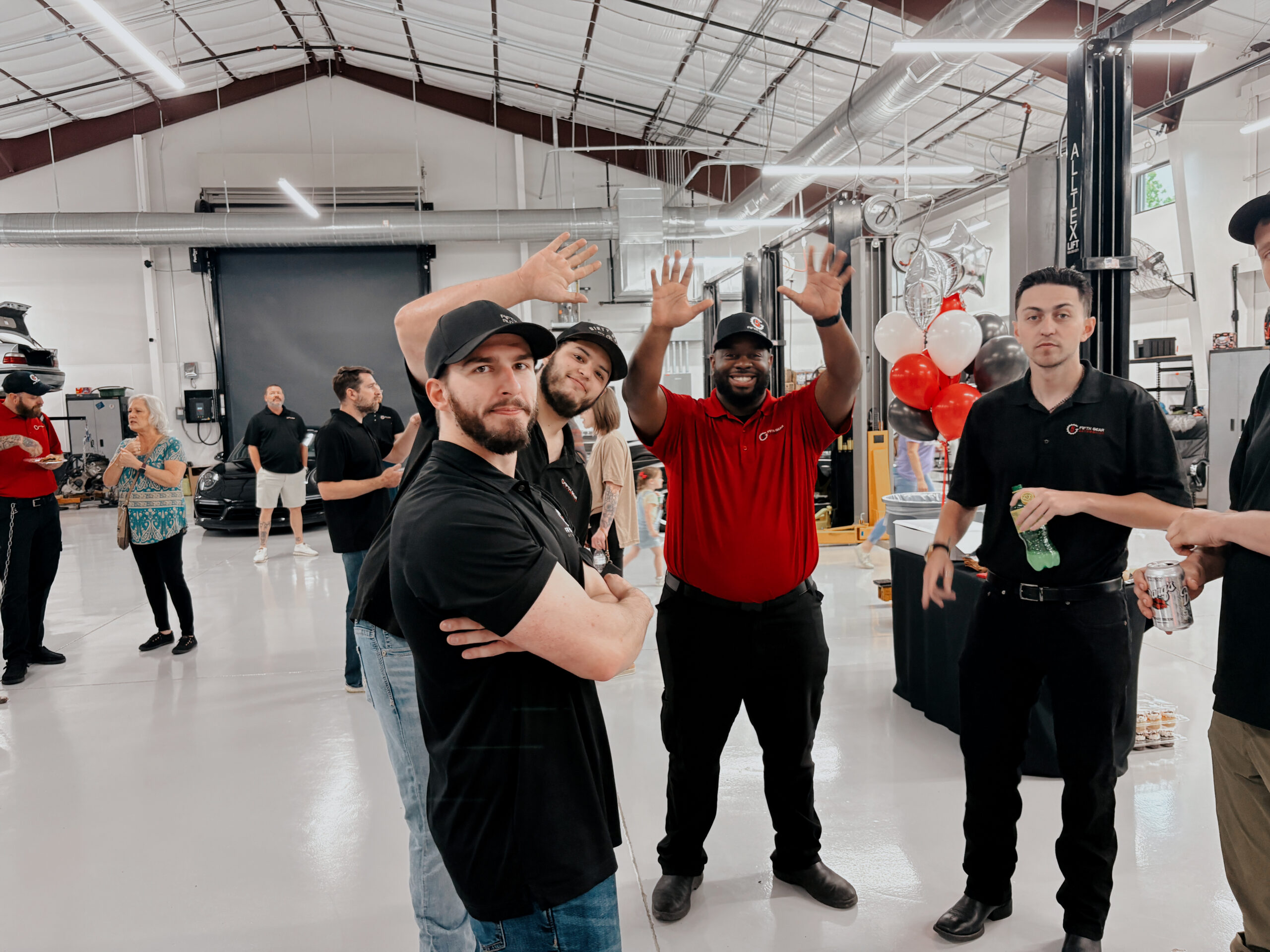 Fifth Gear Automotive Repair Argyle team celebrating at the open house with balloons