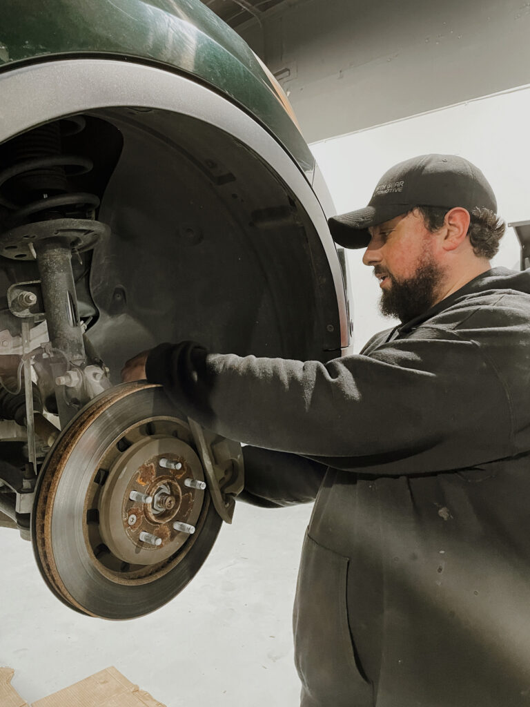 Fifth Gear Technician looking at a CV Joint